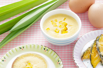 Thai dessert,  steamed custard in blue Bowl with ingredient.