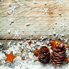 Pine cones, stars and snow in an Xmas background