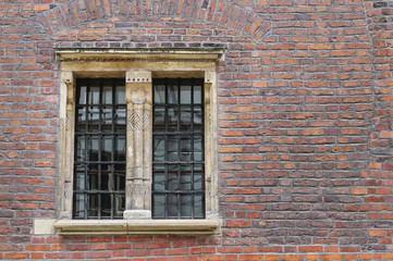 Medieval brick wall with large window