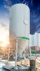 Fototapeta premium Concrete mixing tower. Concept of on-site construction facility.