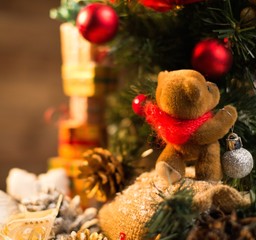 Christmas still life with teddy bear decorating tree