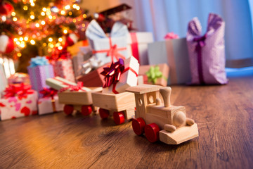 Wooden train with christmas gift