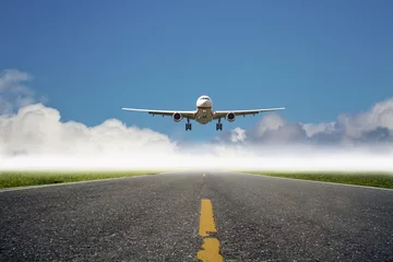 Fotobehang airplane is landing at airport © photoncatcher36