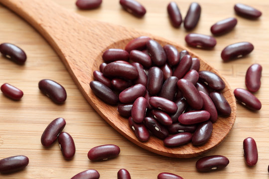 Red kidney bean in a wooden spoon