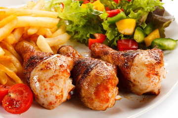 Grilled chicken legs with vegetables