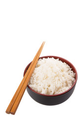 A bowl of rice and a pair of chopstick over white background