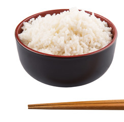 A bowl of rice and a pair of chopstick over white background