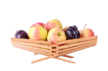 More fruits in basket, isolated on white