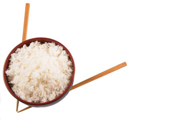 A bowl of rice and a pair of chopstick over white background