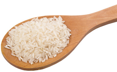Raw and uncooked rice in wooden spoon over white background