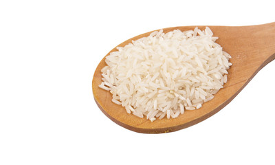 Raw and uncooked rice in wooden spoon over white background