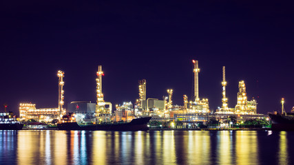Obraz na płótnie Canvas Oil refinery at twilight, business logistic concept