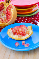 Juicy pomegranate , whole , ripe and cut open