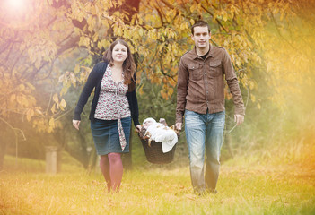 Family relaxing together in autumn nature