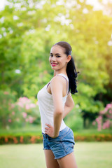 woman in outdoor exercise smiling happy doing yoga