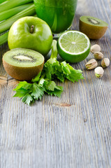 Healthy green food ingredients for smoothie copy space