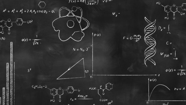 writing scientific formulas on black chalkboard