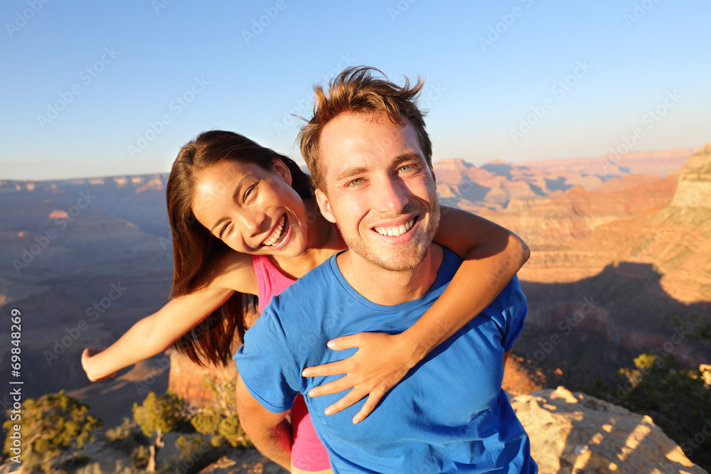 Wall mural Active happy lifestyle couple hiking Grand Canyon