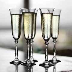 Five fancy glasses of champagne