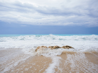 waves breaking on a stony beach