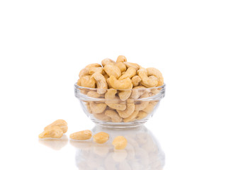 Glass bowl full with cashew nuts.