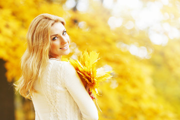 Smiling autumn woman