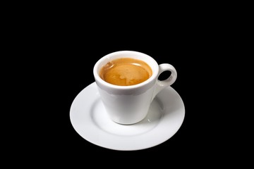 Cup of coffee over the black background