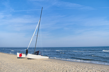 Sailing catamaran on the beach