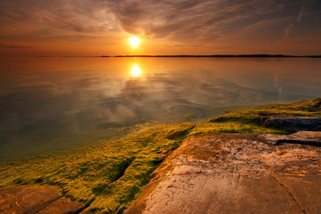 Warm, colorful and still summer evening seascape