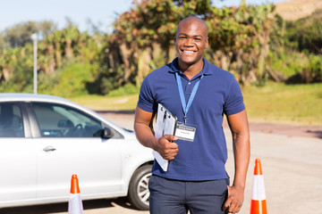 african american driving instructor in testing ground