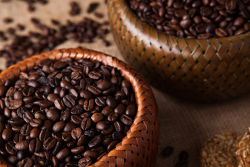 roasted coffee beans in a bamboo basket