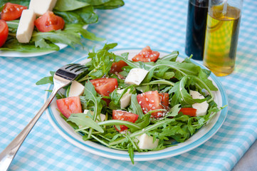 fresh salad with mozzarella, ruccola and tomatoes