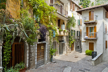 Old narrow street at Limone, Garda lake, Italy