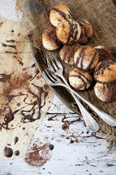 coconut macaroons with dripped chocolate with fork