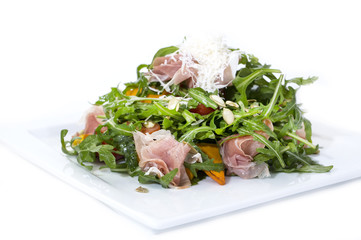 salad of arugula ham cheese on a white background