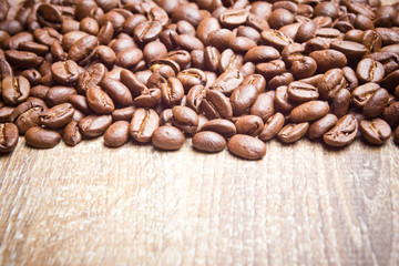 Coffee seeds on wooden surface texture. 