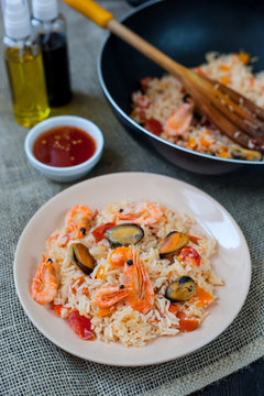 Spanish dish paella with seafood, shrimps in pan