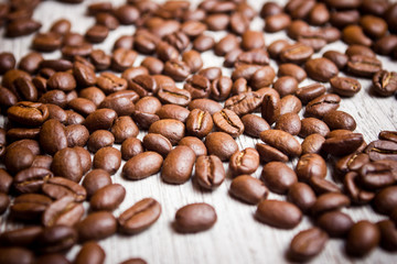 Coffee seeds on wooden surface texture. 