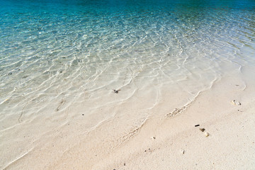 Fototapeta na wymiar White beach with transparent water in FrenchPolinesia, Bora Bora