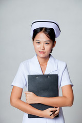 Young Asian nurse hold a clipboard