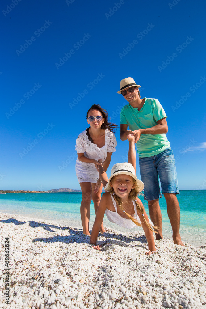 Poster young beautiful family of three have fun on tropical vacation