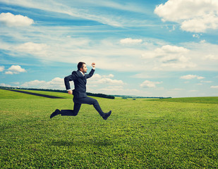 businessman in suit running fast at outdoor