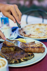 Slices of steak with a fork