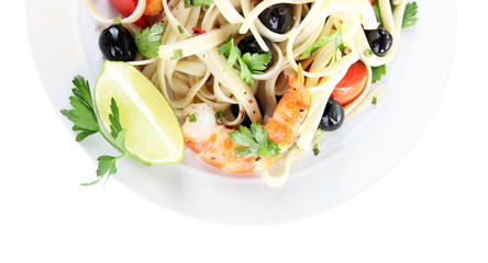 Fresh prawns with spaghetti, olives, tomatoes and parsley in a