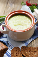 Leek soup on table, close up