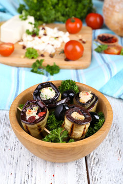 Fried aubergine in a bowl with cottage cheese, bread and