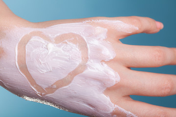 Skin care. Female palm with moisturizing cream.