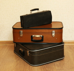Vintage old travel suitcases on floor