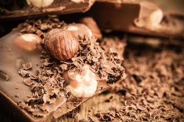 chocolate shavings and pieces on wooden table