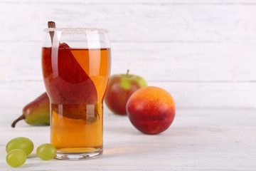 tasty summer drink with fresh fruits, on wooden table